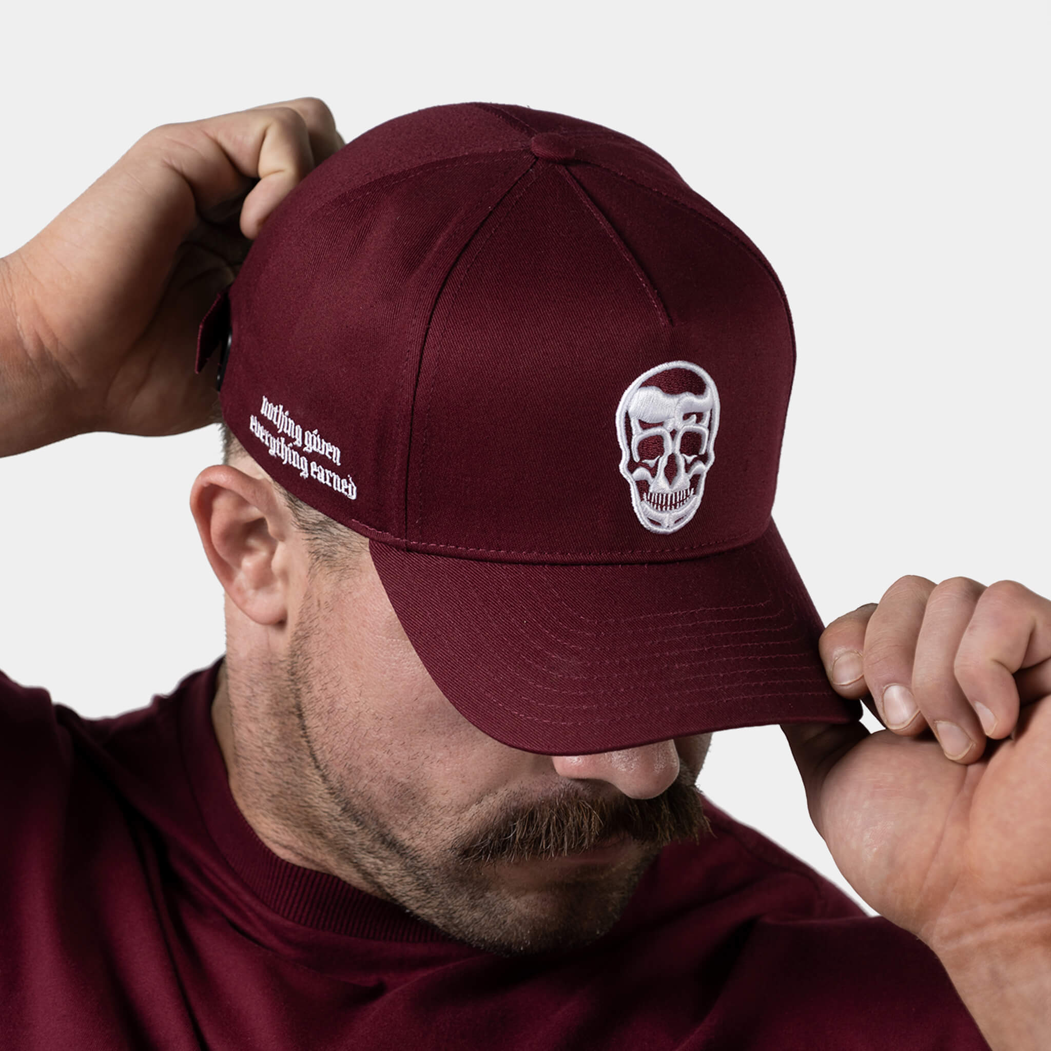 Burgundy store skull cap