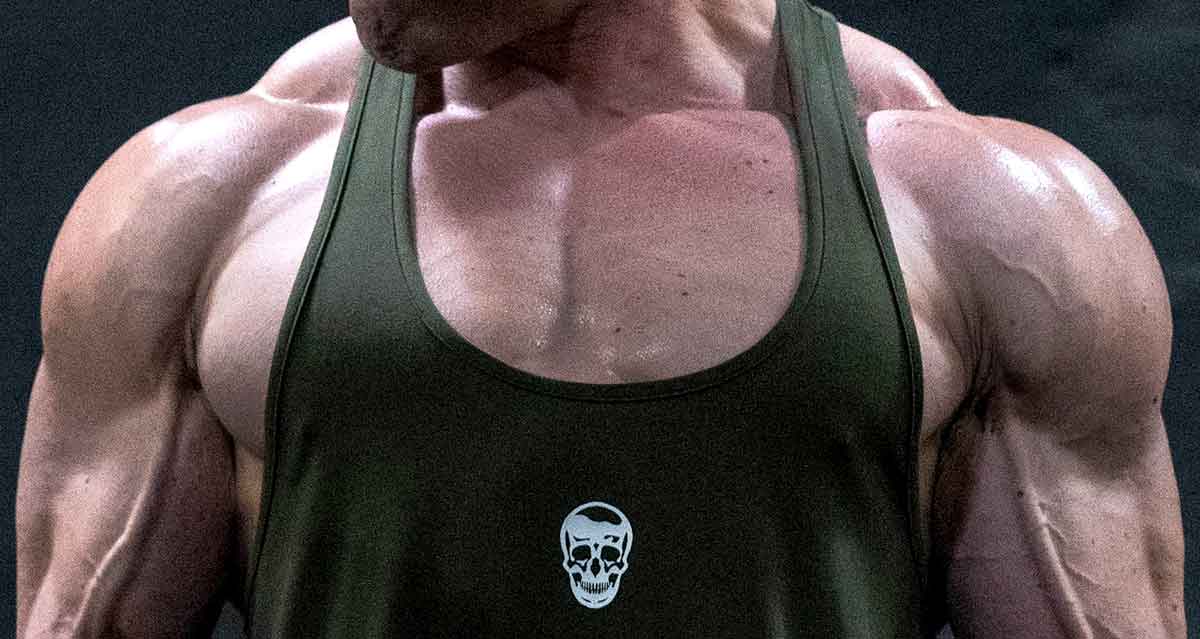 Close-up of a bodybuilder's upper chest, highlighting muscular definition.