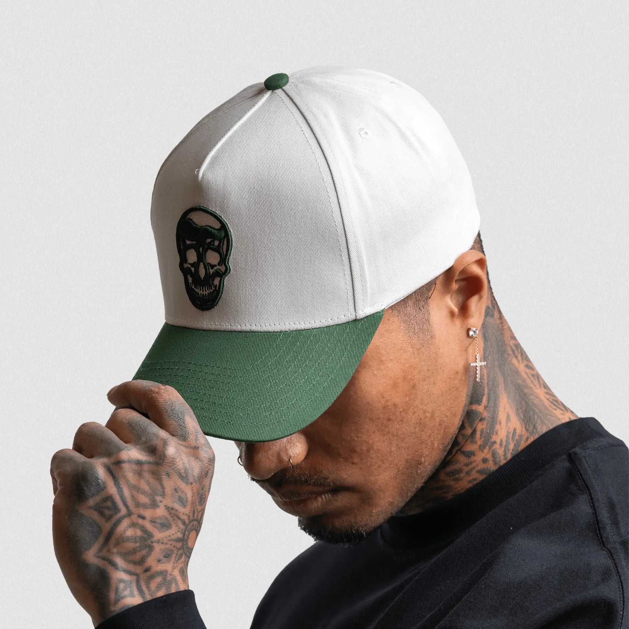 5 panel skull hat white green side view on athlete gray background