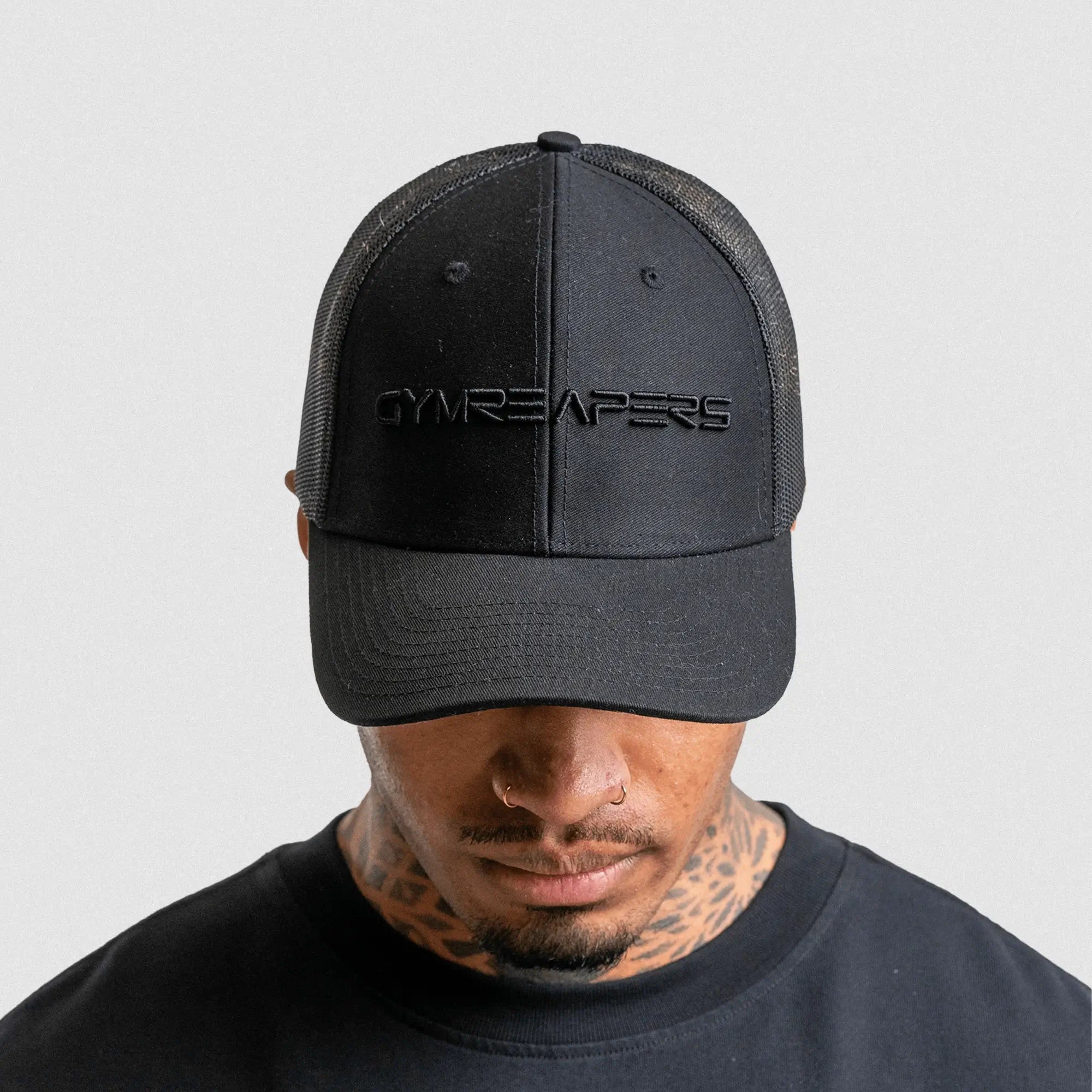 6 panel hat black black on athlete studio gray background. Front facing